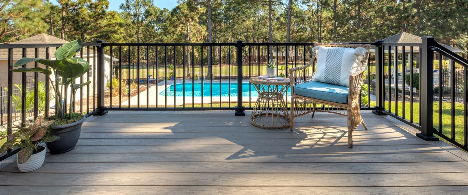 Trex Signature Aluminum Railing in Charcoal Black by the pool